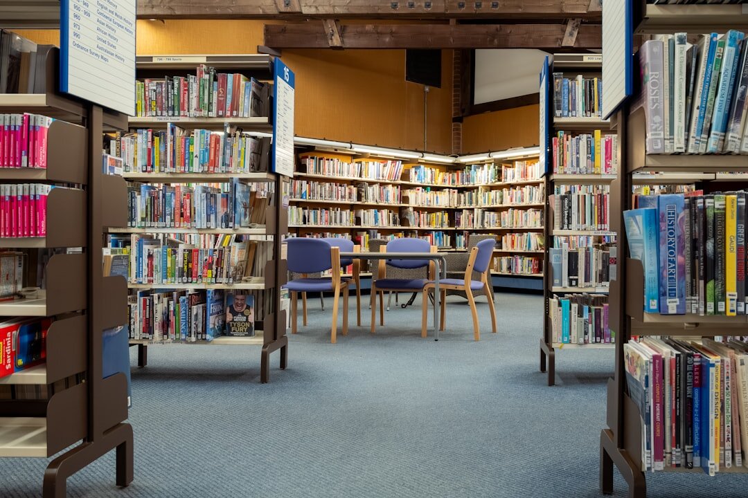 person reading book in library