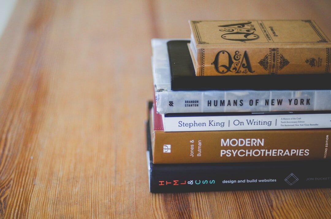 stack of mystery novels on table